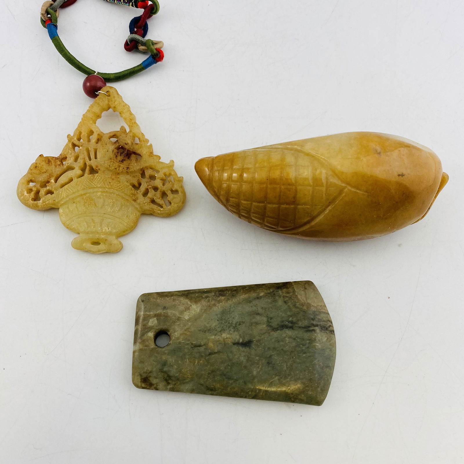 A Set of Three Old Carving Jade Pendants (1 of 7)