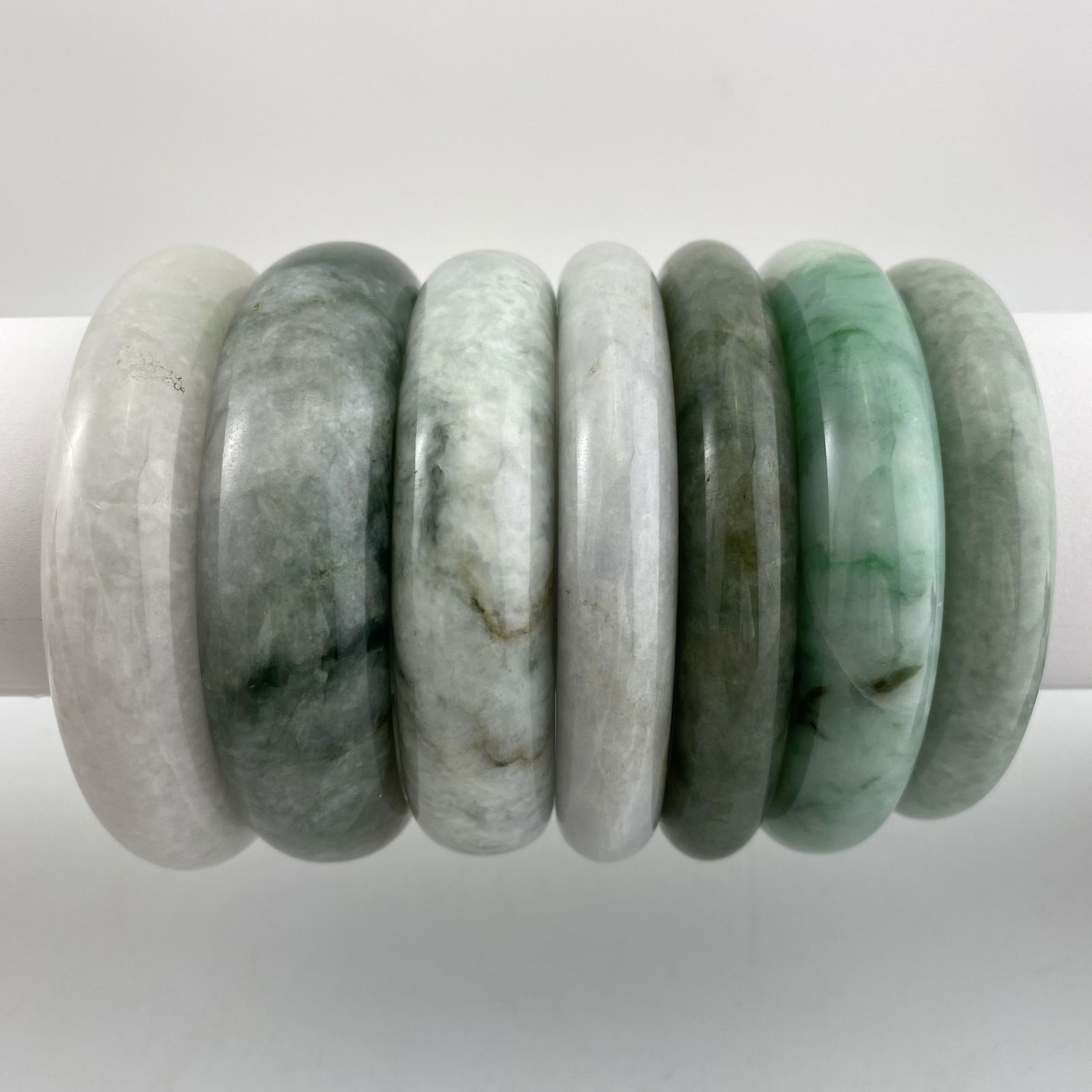 A Set of Seven Natural Jadeite Bangles (1 of 3)