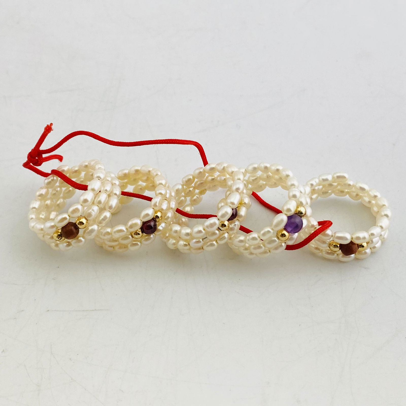 A Set of Five Natural White Pearl Bead Rings (1 of 4)