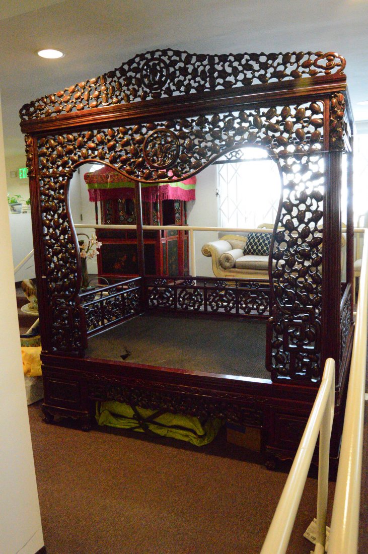 Antique Rosewood Bed Frame: Intricately Carved Antique Rosewood Bed Frame, with wooden canopy and vine-woven bed-slat. Has two built in drawers on either side of the bedfront. Side and Canopy etched with longevity/fertility frui