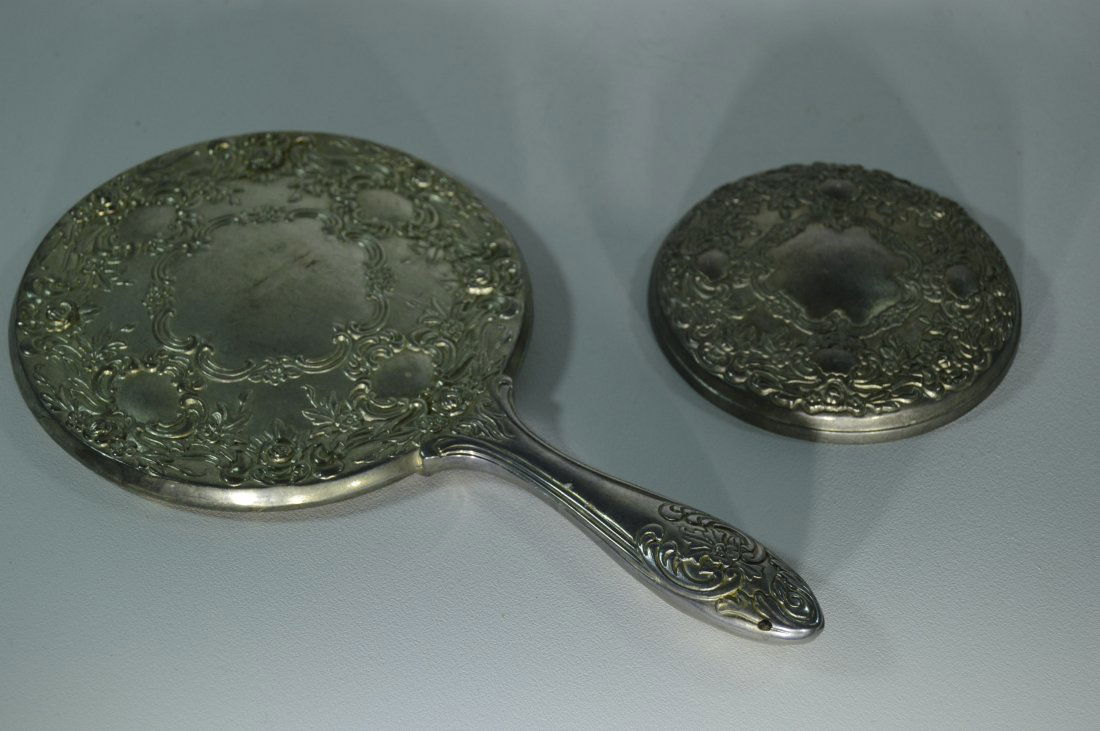 Antique Floral Designed Silver Compact and Hand Mirror: Two Item Lot of antique matching Intricately etched Floral Design Hand and Compact Mirror.