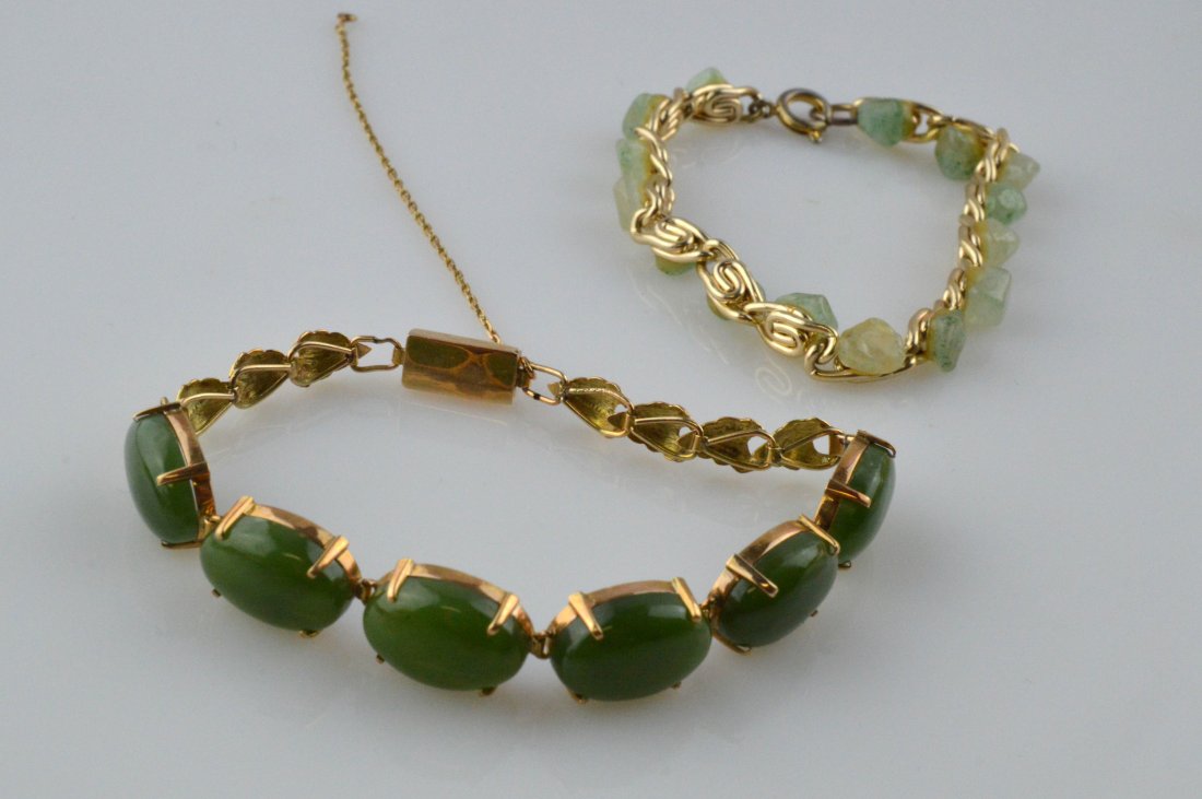 14k Gold Taiwan Jade Bracelet & Chinese Icy Jade: Set of 2 bracelets; one contains 6 oval Taiwan jade mounted into a 14k gold bracelet; one considering in kid size made of small Chinese icy jade stones---Green jade: D x 1.875" Weight: 12.800g Chinese