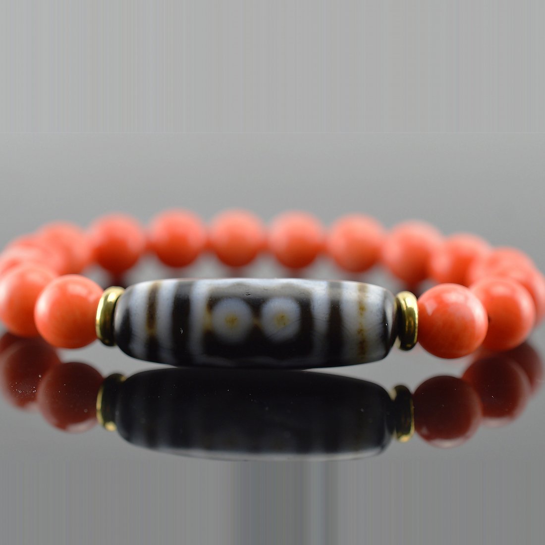 Five-Eye Dzi Bead Coral Beads Bracelet (1 of 3)