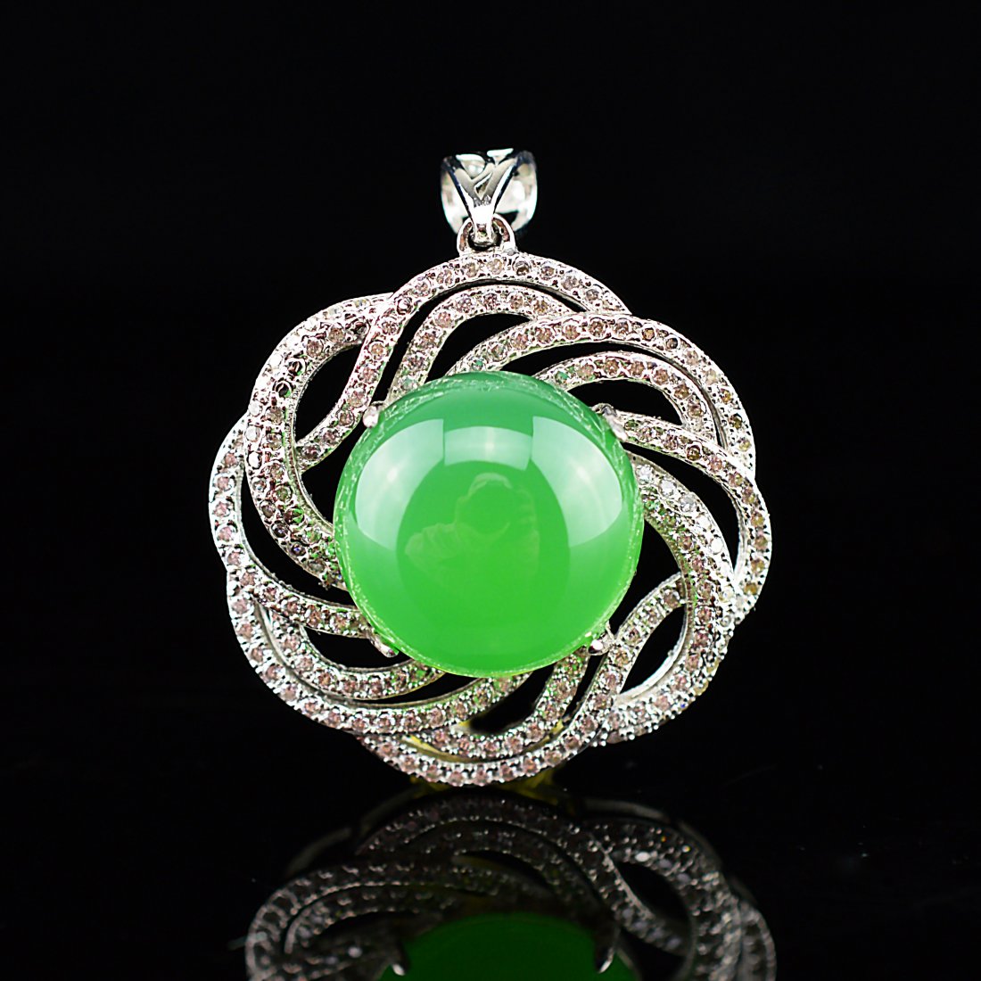 Natural Green Agate Silver Diamond Studded Pendant: A circular wrought silver pendant set with multiple diamonds and a single round natural green agate cabochon.------L x 1.000" H x 1.375" W x 0.500" Weight: 7.000g