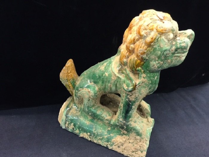 Antique Roof Glazed Tile of the Forbidden City: The Lion or Foo Dog shape of the antique roof glazed tile of the forbidden city building. The glazed tiles have been used in China since the Zhou Dynasty (c. 1046 – 256 BC) as a material for r