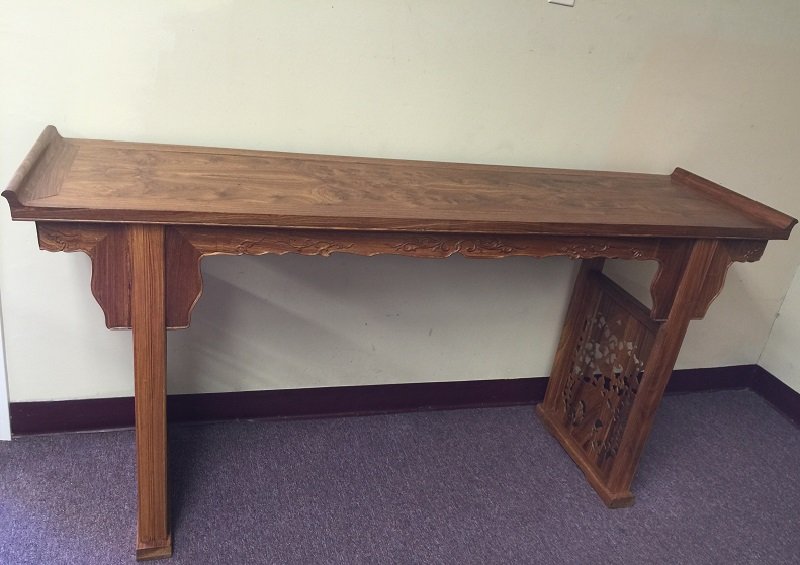 Antique Finely Carved Huanghuali Altar Table: A finely carved Huanghuali altar table with beautiful Huanghuali feature's figures such as ghost face, there are also hollow out art carving on legs. Dimension: H 80cm; L 162cm; W 44cm.