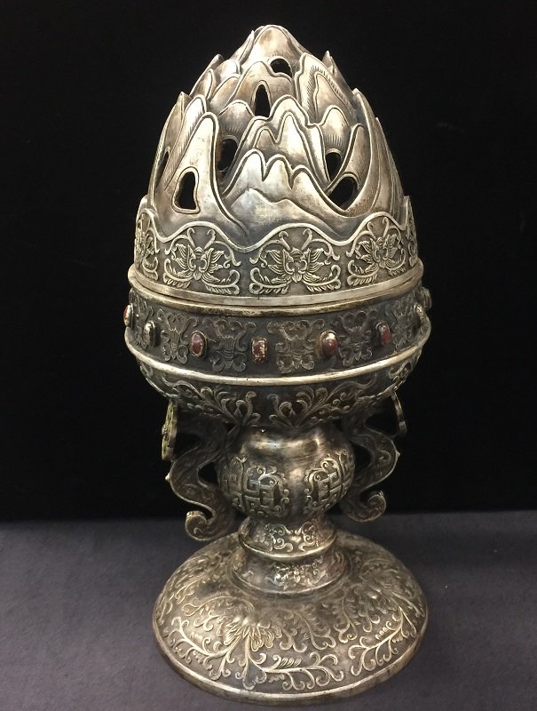 A Finely Carved Antique Bronze Lidded Censer: A finely carved antique bronze lidded likely torch light censer as known as Bo Mountain Censer， the censer body carved flower, Chinese luckily elements along with Ruyi likely handles. there is 