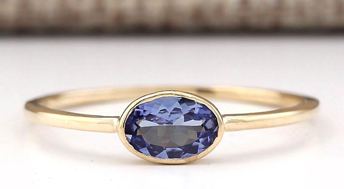 0.60 CTW Natural Blue Tanzanite Ring 14k Solid Yellow: Stamped: 14K Ring Size: 6.75 Total Ring Weight: 1 Grams Gemstone Weight: Total Natural Blue Tanzanite Weight is .60ctw Main Stone Color: Blue Face Measures: 4.73x6.87mm SKU: [703207]