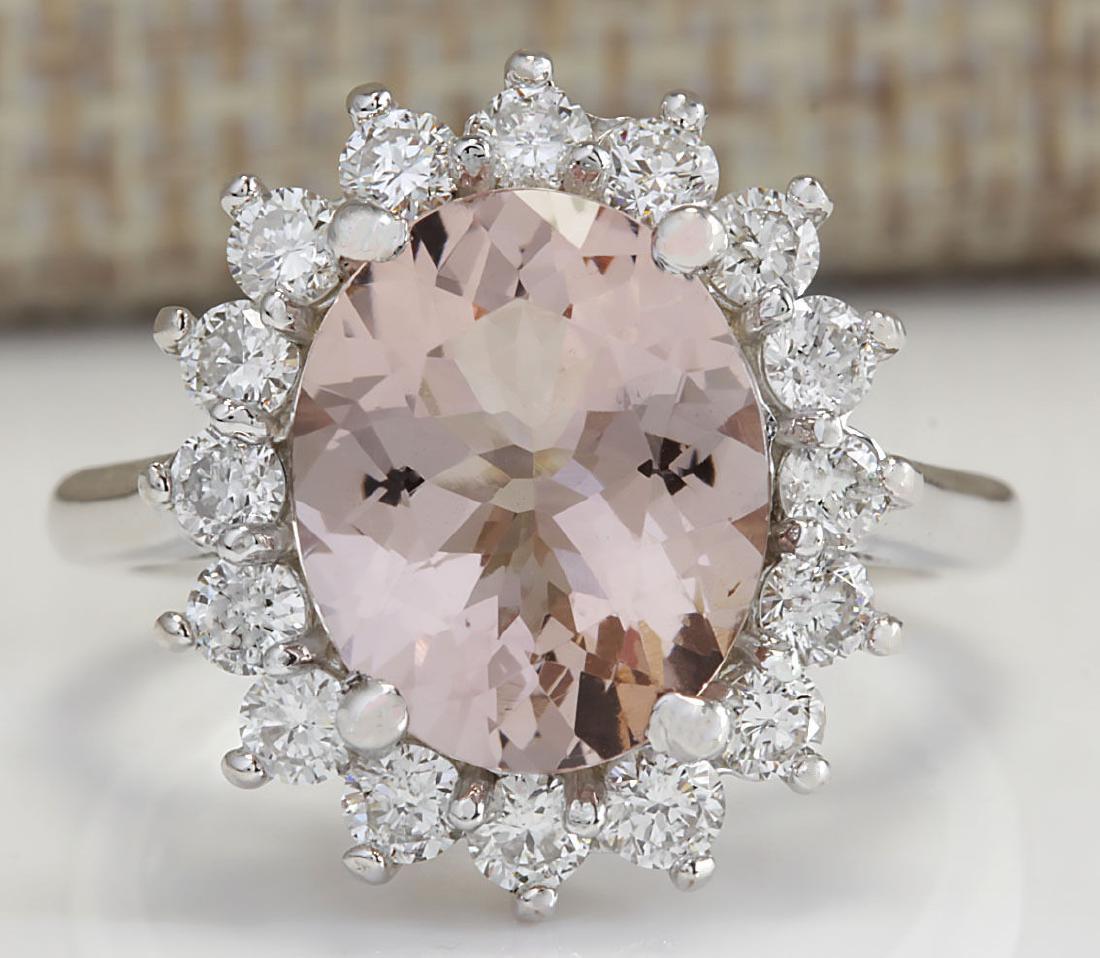4.72CTW Natural Peach Morganite And Diamond Ring In 18K: Stamped: 18K Ring Size: 6.25 Total Ring Weight: 5.5 Grams Diamond Weight: Total natural diamond weight is 1.00carat. VS2-SI1 clarity / F-G color Gemstone Weight: Total Natural Peach Morganite Weight i