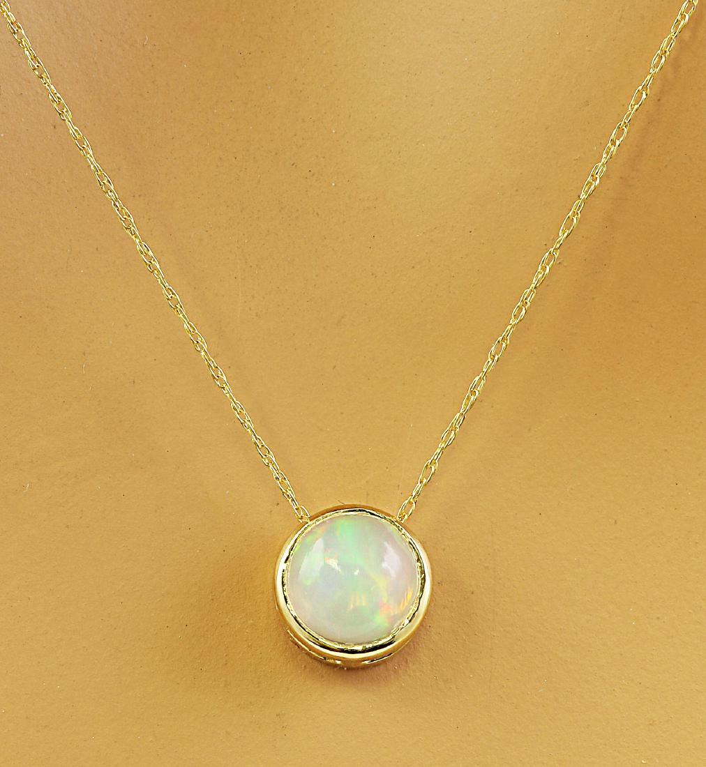 1.50 Carat Opal 14K Yellow Gold Necklace: Stamped: 14K Total Necklace Weight: 1.4 Grams LengthL 18 Inches Opal Weight: 1.50 Carat (6.50x6.50 Millimeters) Face Measures: 8.20x8.20 Millimeter SKU: [600190]