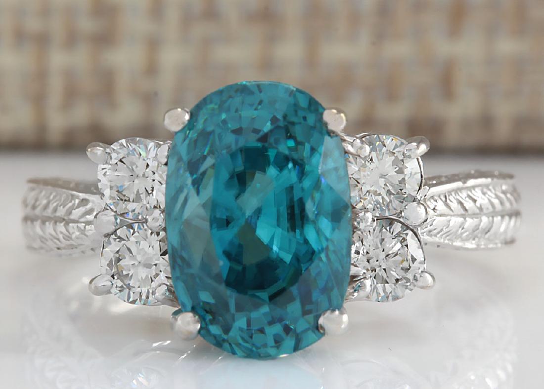 7.07Carat Natural Blue Zircon And Diamond Ring 14K: Stamped: 14K Ring Size: 7 Total Ring Weight: 6.2 Grams Diamond Weight: Total natural diamond weight is .60carat. VS2-SI1 clarity / F-G color Gemstone Weight: Total Natural Zircon Weight is 6.47ctw (Me