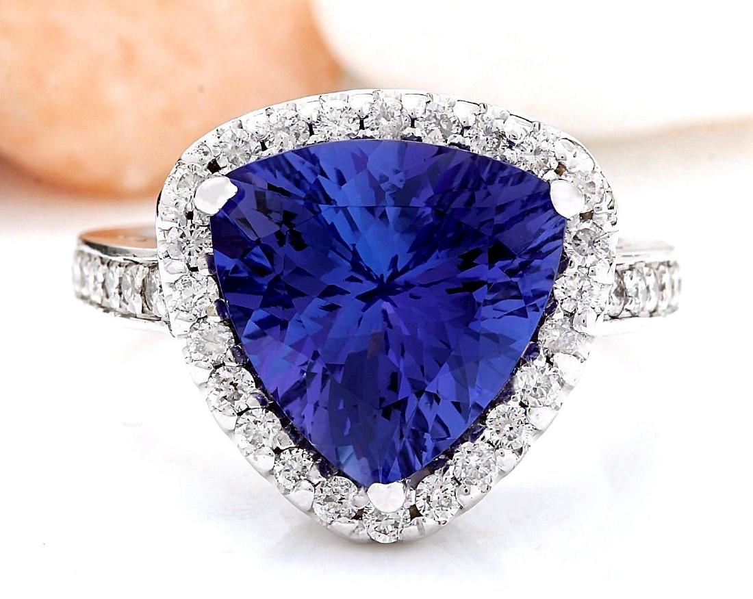 6.90 Carat Natural Tanzanite 18K Solid White Gold: 6.90 Carat Natural Tanzanite 18K Solid White Gold Diamond Ring Item Type: Ring Item Style: Cocktail Material: 18K White Gold Mainstone: Tanzanite Stone Color: Blue Stone Weight: 6.30 Carat Stone Shape