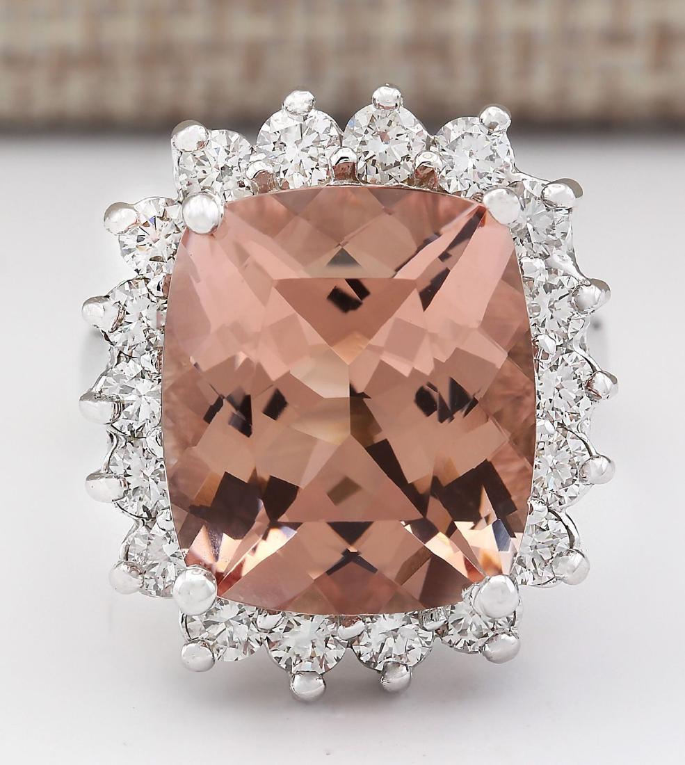 12.21 CTW Natural Morganite And Diamond Ring In 18K: Stamped: 18K Ring Size: 7 Total Ring Weight: 10.5 Grams Diamond Weight: Total natural diamond weight is 1.54carat. VS2-SI1 clarity / F-G color Gemstone Weight: Total Natural Morganite Weight is 10.67c