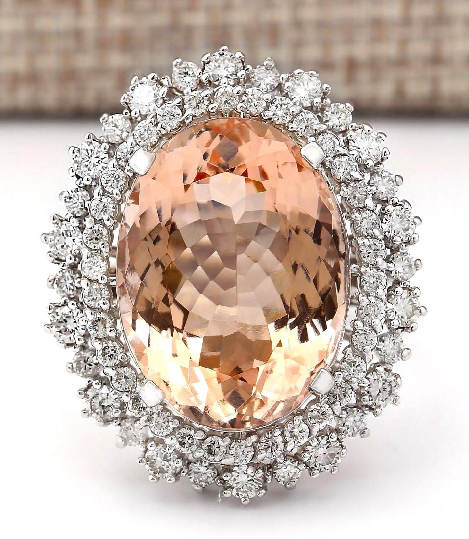 16.60 Carat Natural Morganite And Diamond Ring In 18K: Stamped: 18K Ring Size: 6.5 Total Ring Weight: 10 Grams Diamond Weight: Total natural diamond weight is 1.60carat. VS2-SI1 clarity / G-H color Gemstone Weight: Total Natural Morganite Weight is 15.00c