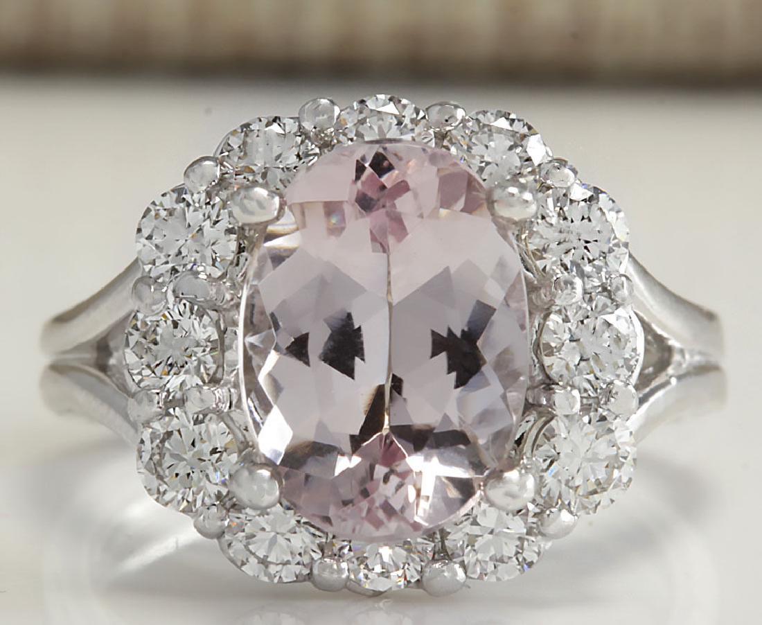 3.70Carat Natural Peach Morganite And Diamond Ring In: Stamped: 18K Ring Size: 5 Total Ring Weight: 6.1Grams Diamond Weight: Total natural diamond weight is 1.35carat. VS2-SI1 clarity / F-G color Gemstone Weight: Total Natural Peach Morganite Weight is 2.