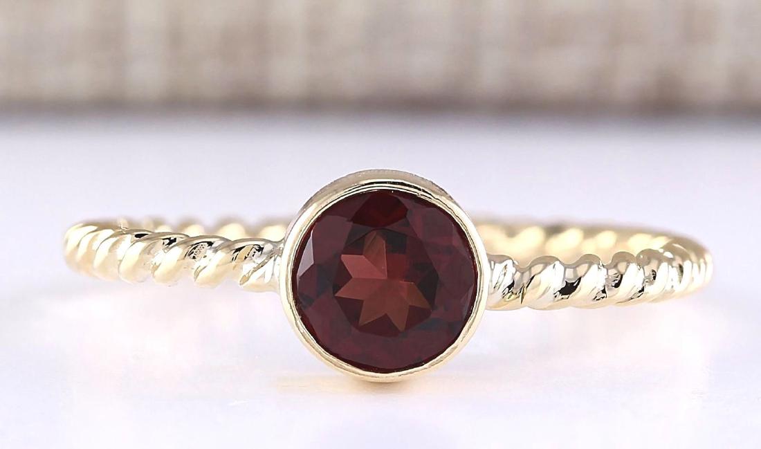 1.00 Carat Natural Garnet Ring In 18K Yellow Gold: Stamped: 18K Ring Size: 7.5 Total Ring Weight: 2 Grams Gemstone Weight: Total Natural Garnet Weight is 1.00ctw Main Stone Color: Red Face Measures: 6.70x6.70mm SKU: [703226]