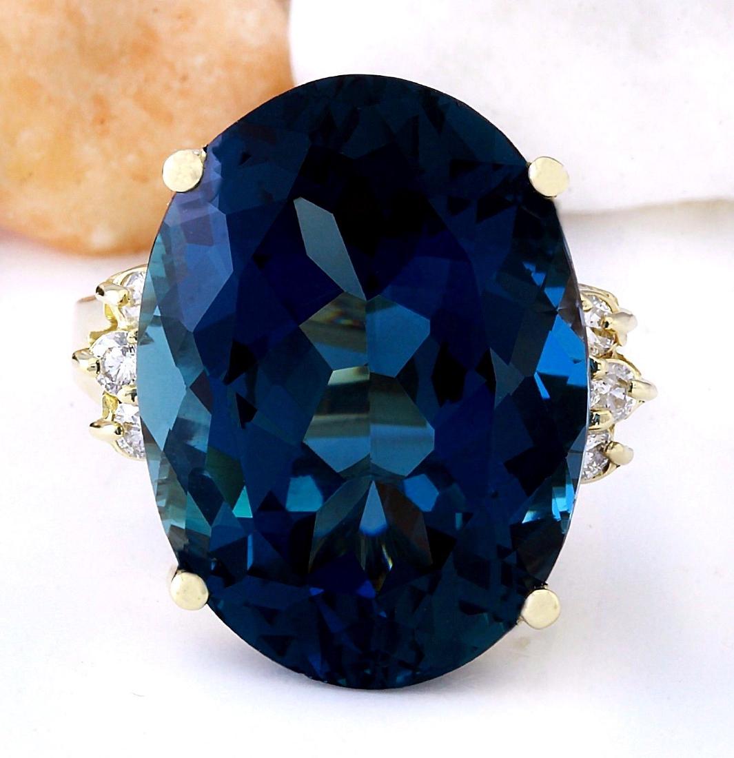 20.71 Carat Natural Topaz 18K Solid Yellow Gold Diamond: 20.71 Carat Natural Topaz 18K Solid Yellow Gold Diamond Ring Item Type: Ring Item Style: Cocktail Material: 18K Yellow Gold Mainstone: Topaz Stone Color: London Blue Stone Weight: 20.33 Carat Stone Sh