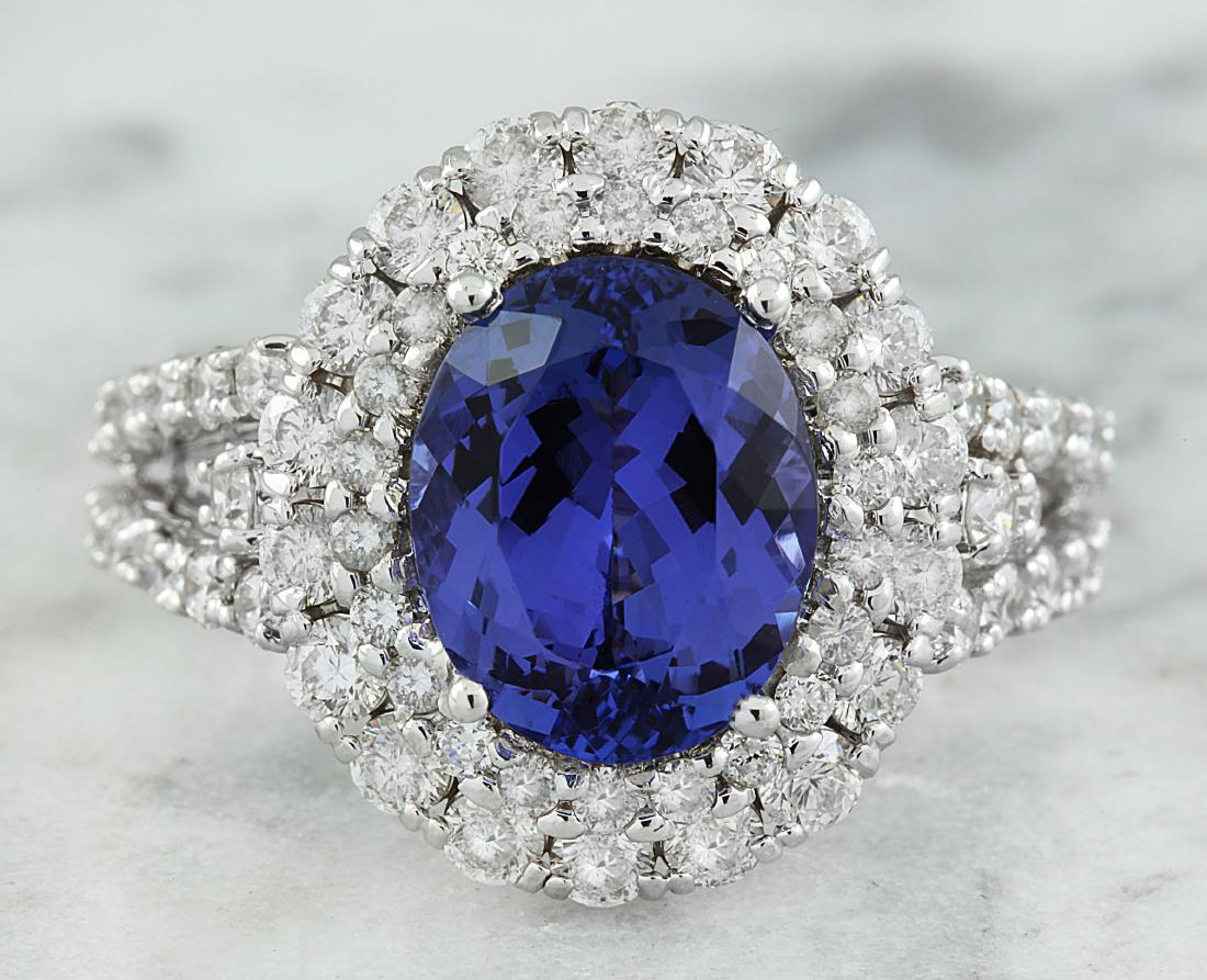 5.40 Carat Tanzanite 18K White Gold Diamond Ring: Stamped: 18K Total Ring Weight: 6.1 Grams Tanzanite Weight 3.60 Carat (11.00x9.00 Millimeters) Diamond Weight: 1.80 carat (F-G Color, VS2-SI1 Clarity ) Face Measures: 17.50x15.15 Millimeter SKU: [6004