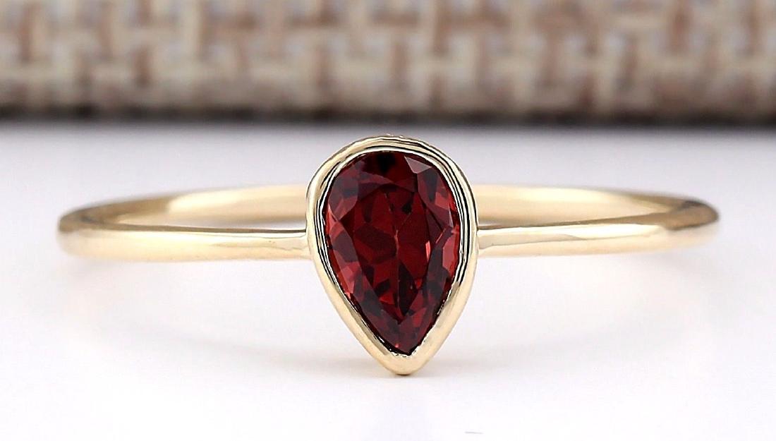 .50 Carat Natural Garnet Ring In 18K Yellow Gold: Stamped: 18K Ring Size: 7.5 Total Ring Weight: 1.1 Grams Gemstone Weight: Total Natural Garnet Weight is .50ctw Main Stone Color: Red Face Measures: 7.10x5.05mm SKU: [703378]