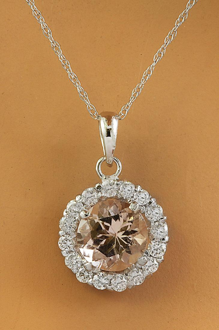 1.82 Carat Morganite 18K White Gold Diamond Necklace: Stamped: 18K Total Necklace Weight: 0.90 Grams Necklace Length 18 Inches Morganite Weight: 1.50 Carat (7.00x7.00 Millimeters) Diamond Weight: 0.32 Carat (F-G Color, VS2-SI1 Clarity) Face Measures: 10.