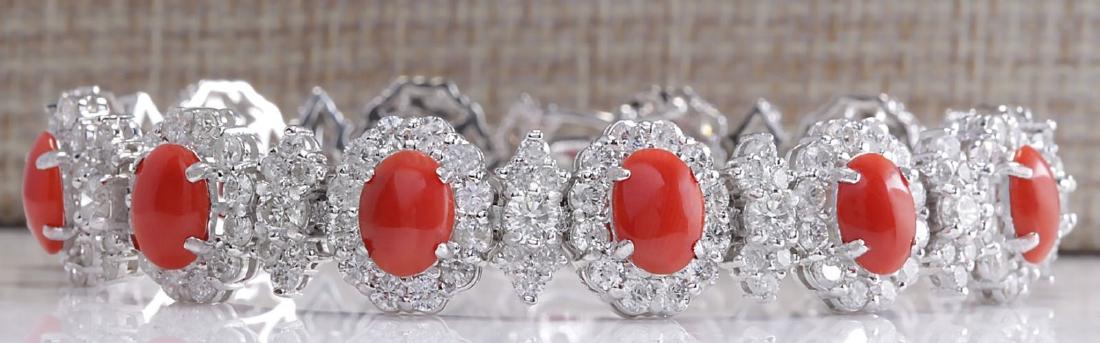 18.77 Carat Natural Red Coral And Dimond Bracelet In: Stamped: 18K Bracelet Width: 12.30mm Bracelet Length: 7.5 Inches Total Bracelet Weight: 27.3 Grams Diamond Weight: Total natural diamond weight is 10.45carat. VS2-SI1 clarity / G-H color Gemstone Weig