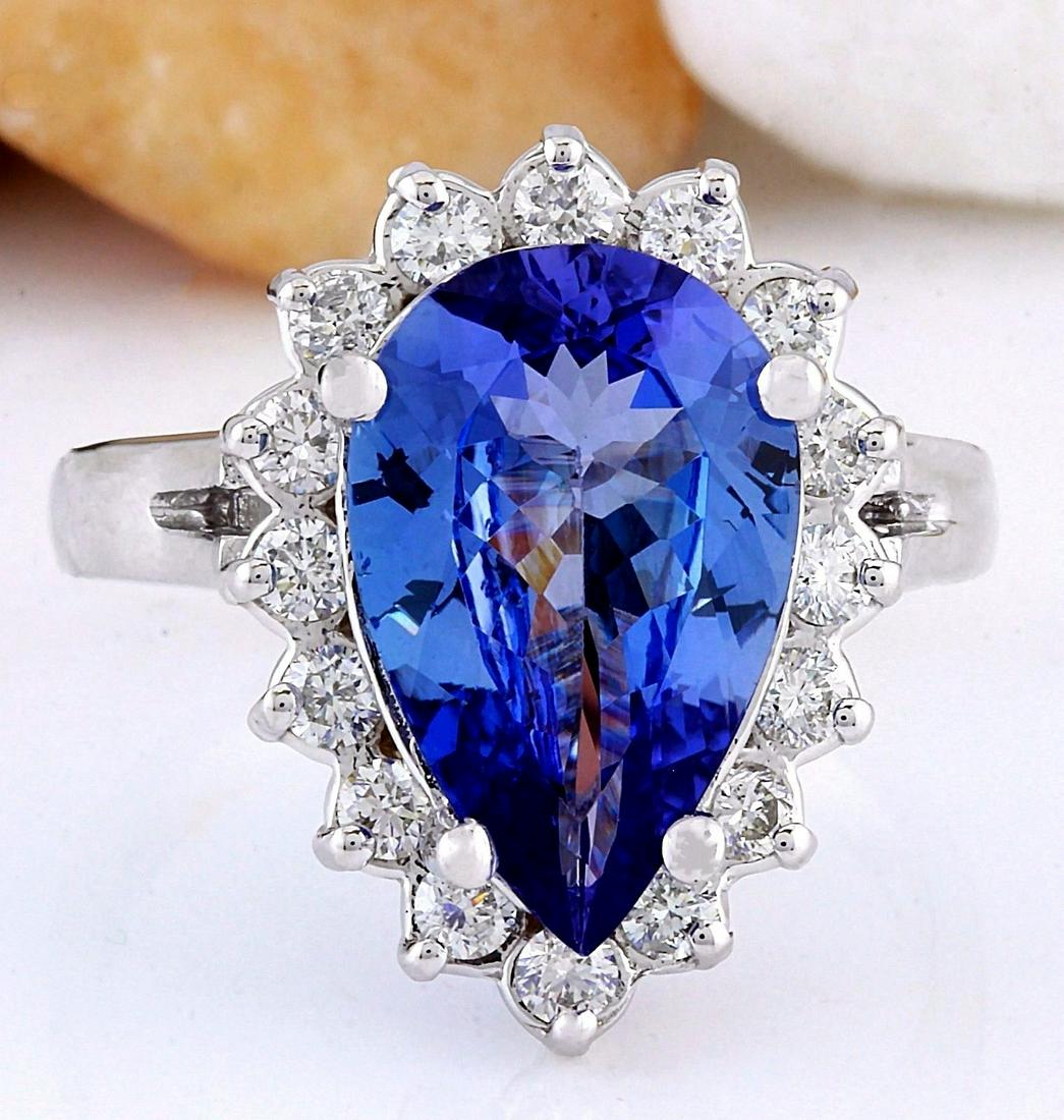 4.47 Carat Natural Tanzanite 18K Solid White Gold: 4.47 Carat Natural Tanzanite 18K Solid White Gold Diamond Ring Item Type: Ring Item Style: Cocktail Material: 18K White Gold Mainstone: Tanzanite Stone Color: Blue Stone Weight: 3.67 Carat Stone Shape