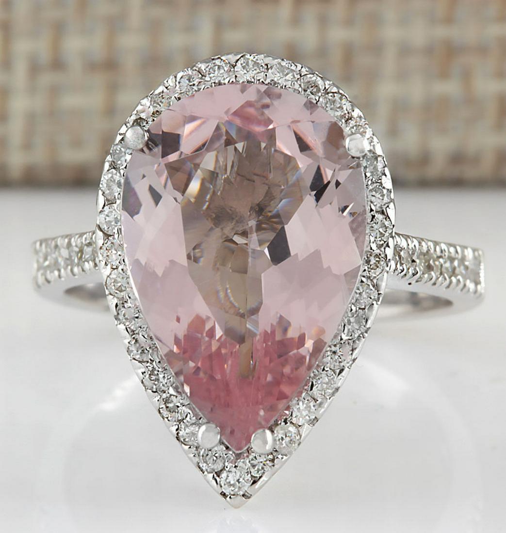 6.82Carat Natural Morganite And Diamond Ring In 18K: Stamped: 18K Ring Size: 7 Total Ring Weight: 6.8 Grams Diamond Weight: Total natural diamond weight is .75carat. VS2-SI1 clarity / F-G color Gemstone Weight: Total Natural Morganite Weight is 6.07ctw 