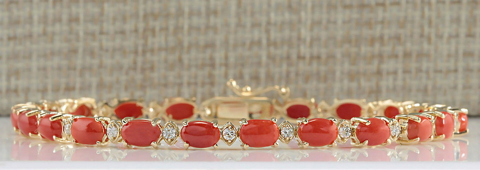 8.77 Carat Natural Red Coral And Diamond Bracelet In: Stamped: 18K Length: 7.5 inch Total Bracelet Weight: 8 Grams Diamond Weight: Total natural diamond weight is .55carat. VS2-SI1 clarity / F-G color Gemstone Weight: Total Natural Coral Weight is 8.22ct