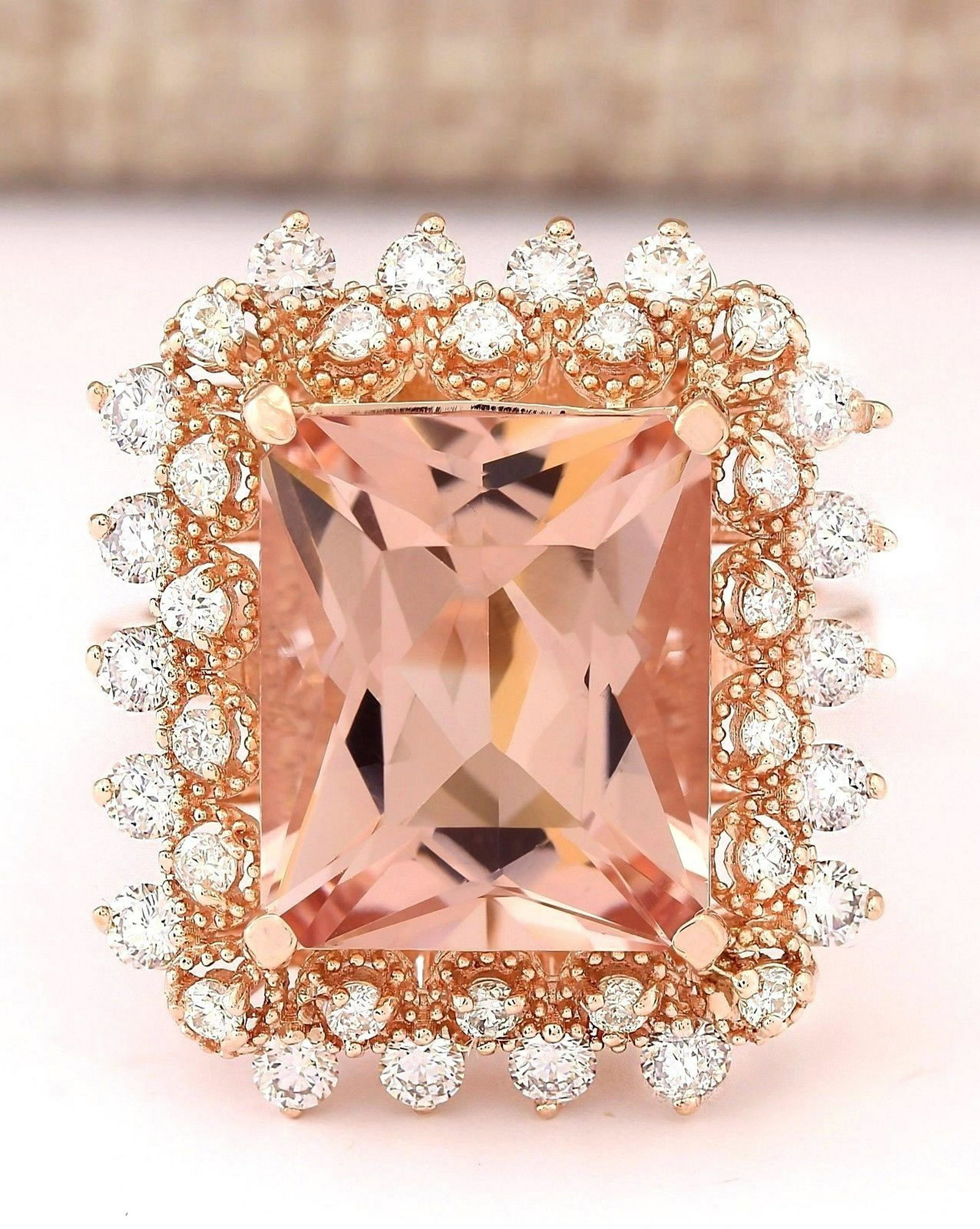 7.92 Carat Natural Morganite And Diamond Ring In 18K: Stamped: 18K Ring Size: 6.75 Total Ring Weight: 7.1Grams Diamond Weight: Total natural diamond weight is .80carat. VS2-SI1 clarity / G-H color Gemstone Weight: Total Natural Morganite Weight is 7.07ct