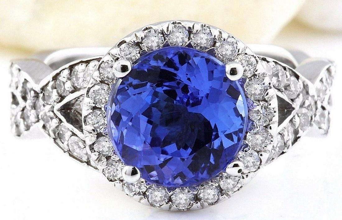 3.80 Carat Natural Tanzanite 18K Solid White Gold: 3.80 Carat Natural Tanzanite 18K Solid White Gold Diamond Ring Item Type: Ring Item Style: Engagement Material: 18K White Gold Mainstone: Tanzanite Stone Color: Blue Stone Weight: 3.10 Carat Stone Sha