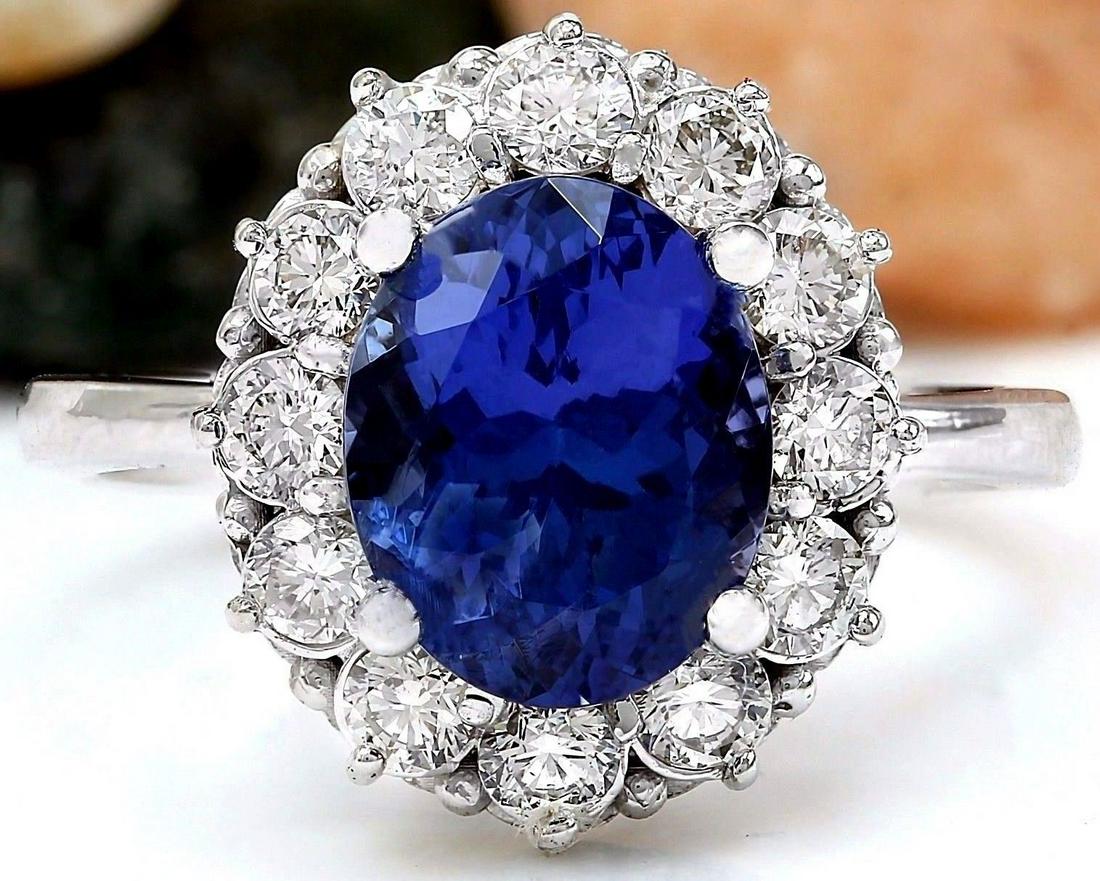4.50 Carat Natural Tanzanite 18K Solid White Gold: 4.50 Carat Natural Tanzanite 18K Solid White Gold Diamond Ring Item Type: Ring Item Style: Engagement Material: 18K White Gold Mainstone: Tanzanite Stone Color: Blue Stone Weight: 3.50 Carat Stone Sha