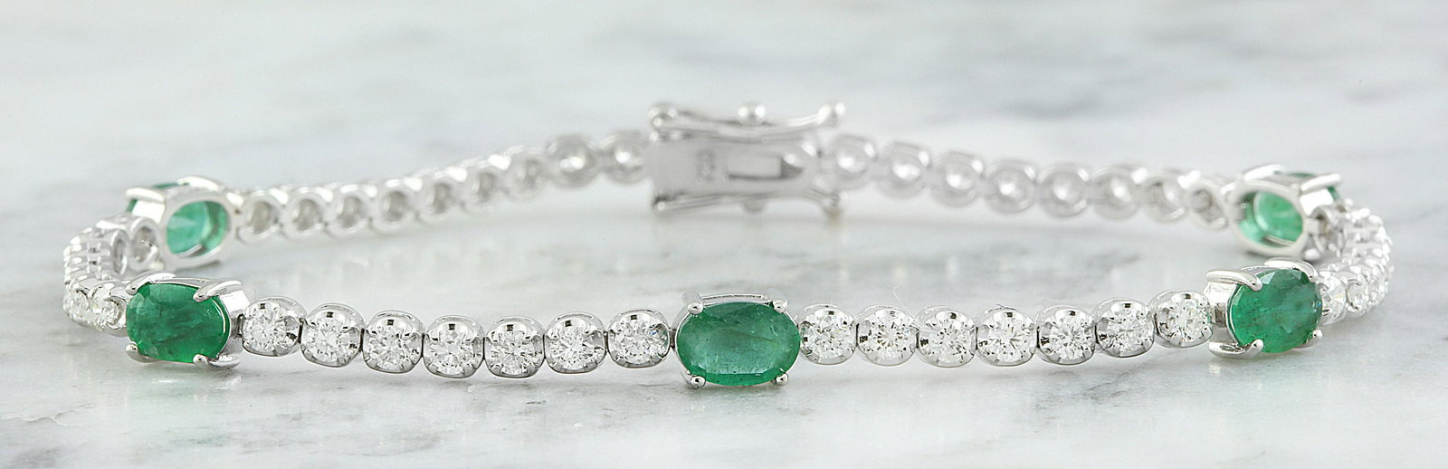 4.03 Carat Emerald 18K White Gold Diamond Bracelet: Stamped: 750 Total Bracelet Weight: 8 Grams Bracelet Length: 7 Inches Emerald Weight: 2.20 Carat (6.00x4.00 Millimeter) Diamond Weight: 1.83 Carat (F-G Color, VS2-SI1 Clarity Face Measures: 4.00 Milli
