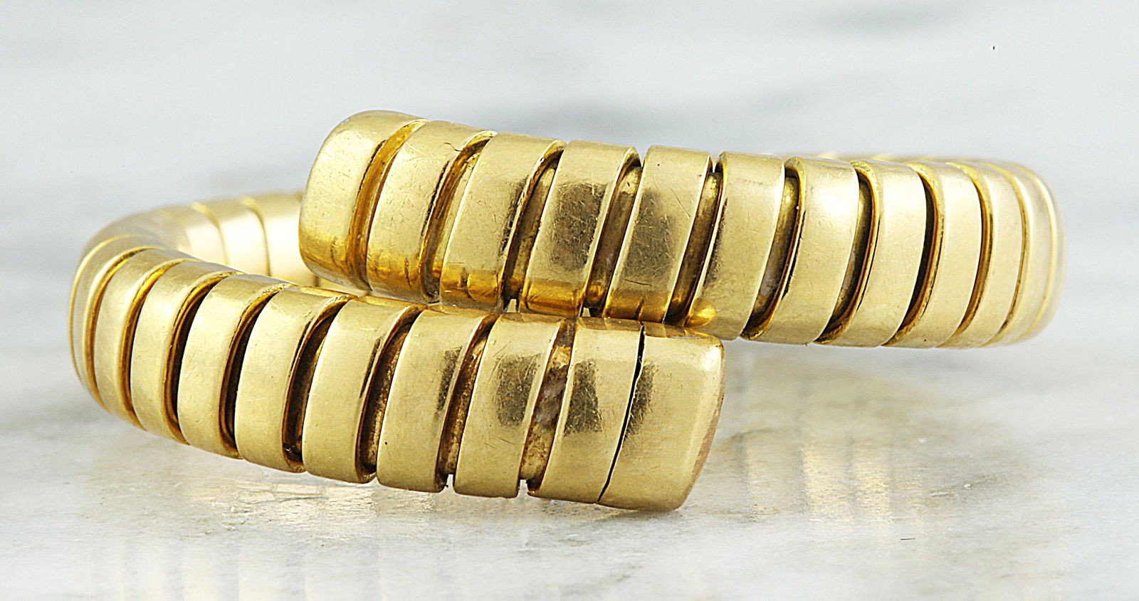 Authentic Bvlgari 18K Yellow Gold Ring: Stamped: 750 Total Ring Weight: 9.5 Grams Face Measures: 10.00 Millimeter SKU: [600591]