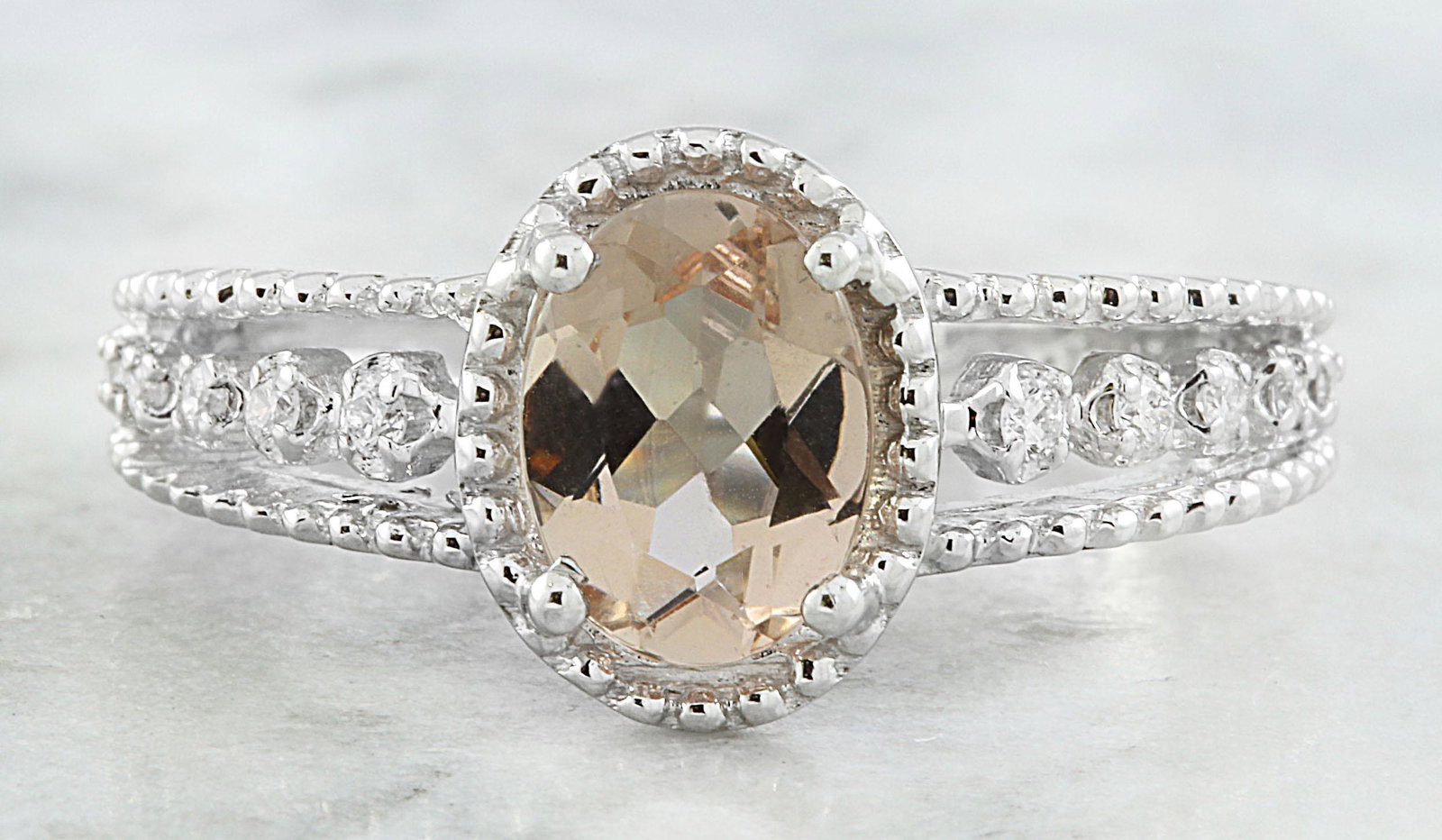 1.29 Carat Morganite 18K White gold Diamond Ring: Stamped: 18K Total Ring Weight: 4 Grams Sapphire Weight 1.19 Carat (8.00x6.00 Millimeters) Diamond Weight: 0.10 carat (F-G Color, VS2-SI1 Clarity ) Face Measures: 10.50x8.35 Millimeter SKU: [600991]