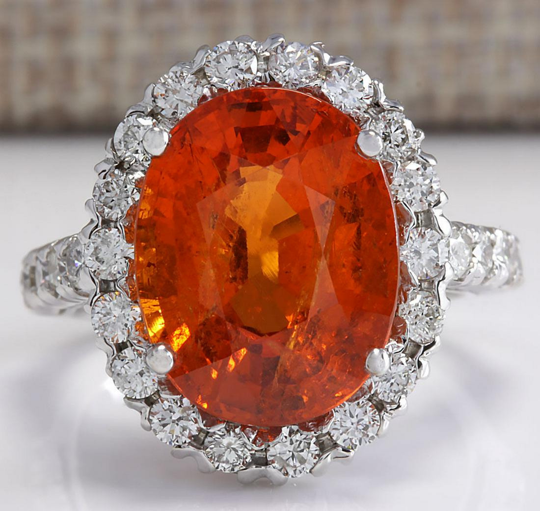 11.41Ct Natural Mandarin Garnet And Diamond Ring In18K: Stamped: 18K Ring Size: 6.5 Total Ring Weight: 5.6 Grams Diamond Weight: Total natural diamond weight is 1.12carat. VS2-SI1 clarity / F-G color Gemstone Weight: Total Natural Garnet Weight is 10.29ctw