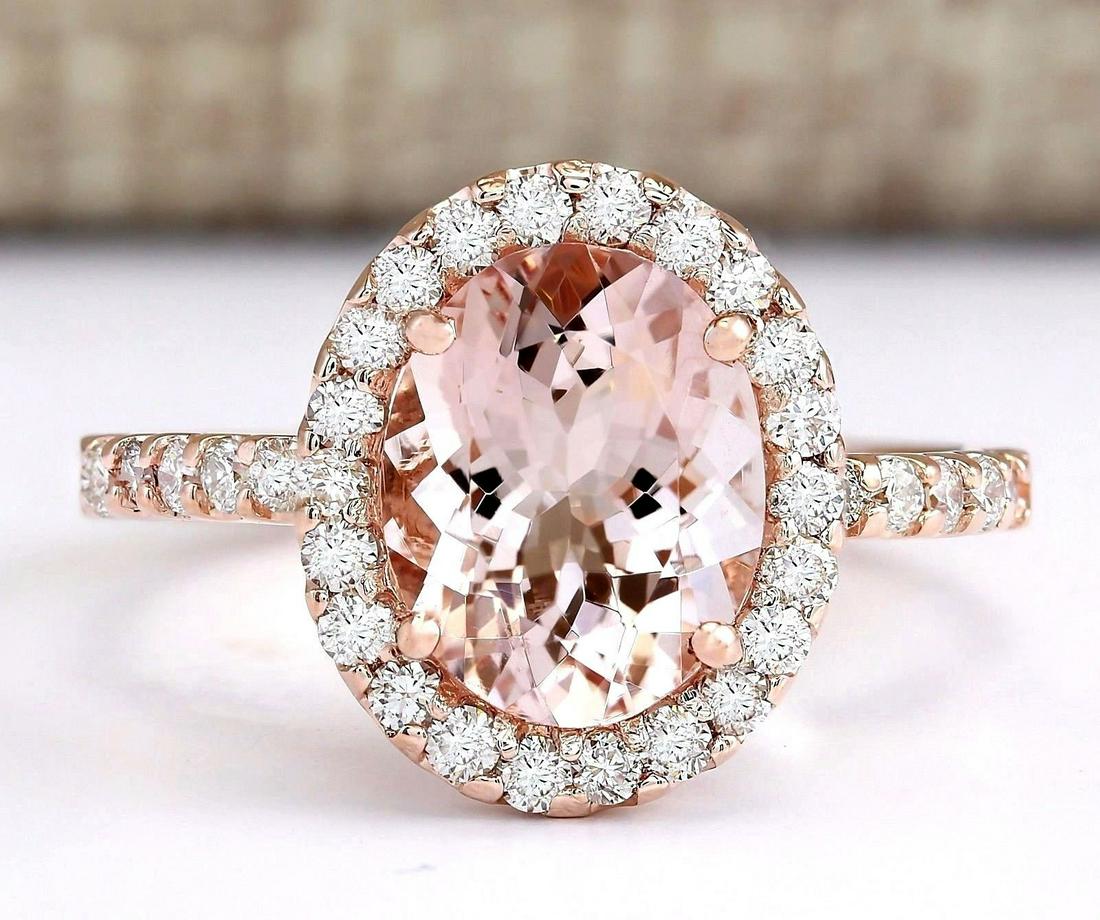 2.67 Carat Natural Morganite And Diamond Ring In 18K: Stamped: 18K Ring Size: 7 Total Ring Weight: 3.7 Grams Diamond Weight: Total natural diamond weight is .60carat. VS2-SI1 clarity / G-H color Gemstone Weight: Total Natural Morganite Weight is 2.07ctw 