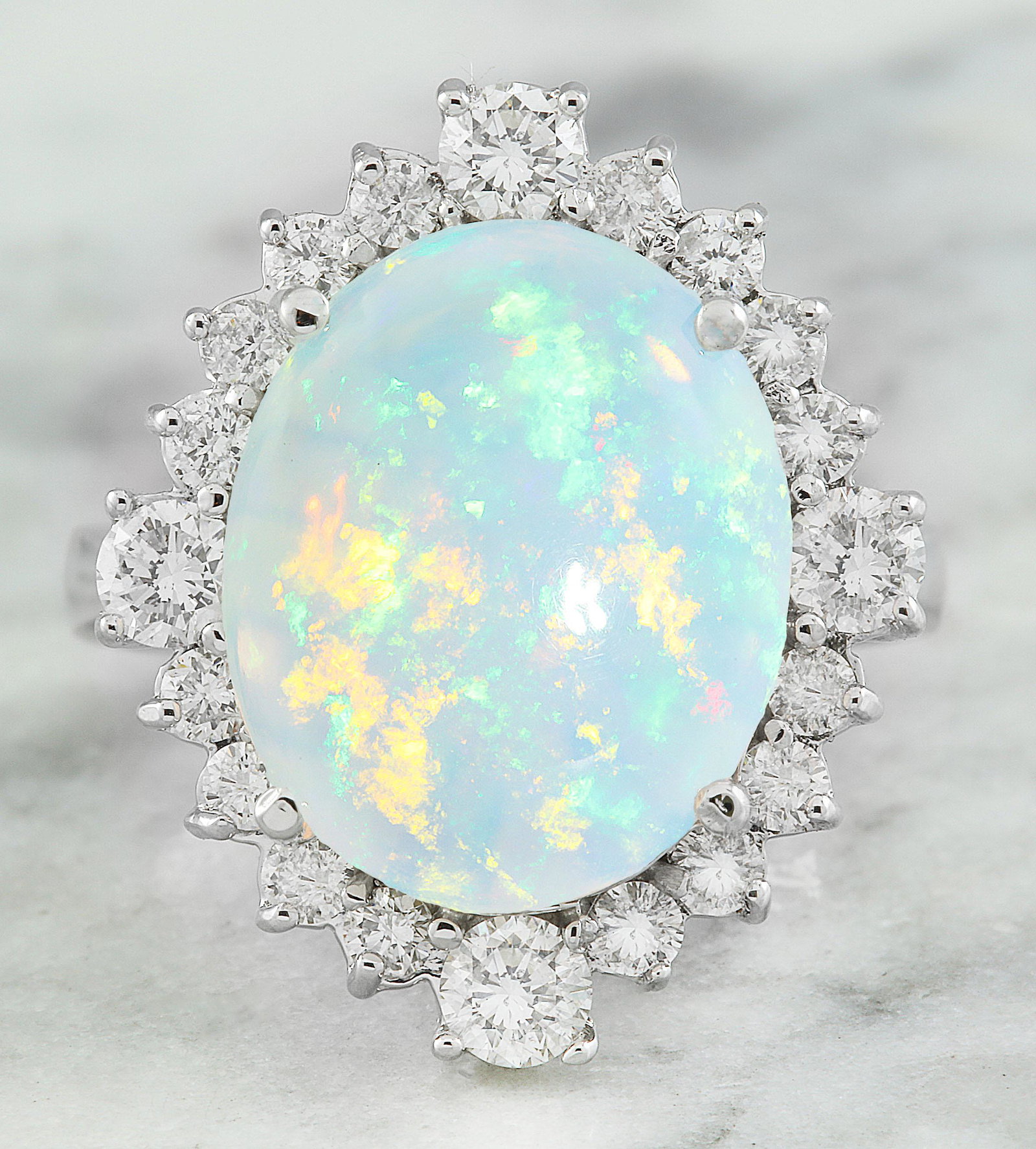 5.85 Carat Opal 18K White Gold Diamond Ring: Stamped: 18K Total Ring Weight: 6.5 Grams Opal Weight 4.85 Carat (14.70x12.00 Millimeters) Diamond Weight: 1.00 carat (F-G Color, VS2-SI1 Clarity ) Face Measures: 21.25x18.00 Millimeter SKU: [600643]