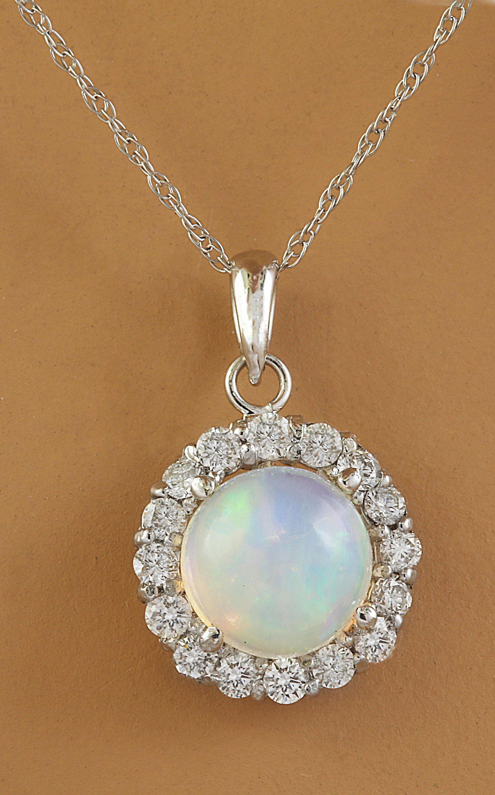 1.82 Carat Opal 18K White Gold Diamond Necklace: Stamped: 18K Total Necklace Weight: 0.90 Grams Necklace Length 18 Inches Opal Weight: 1.50 Carat (7.00x7.00 Millimeters) Diamond Weight: 0.32 Carat (F-G Color, VS2-SI1 Clarity) Face Measures: 10.90x10