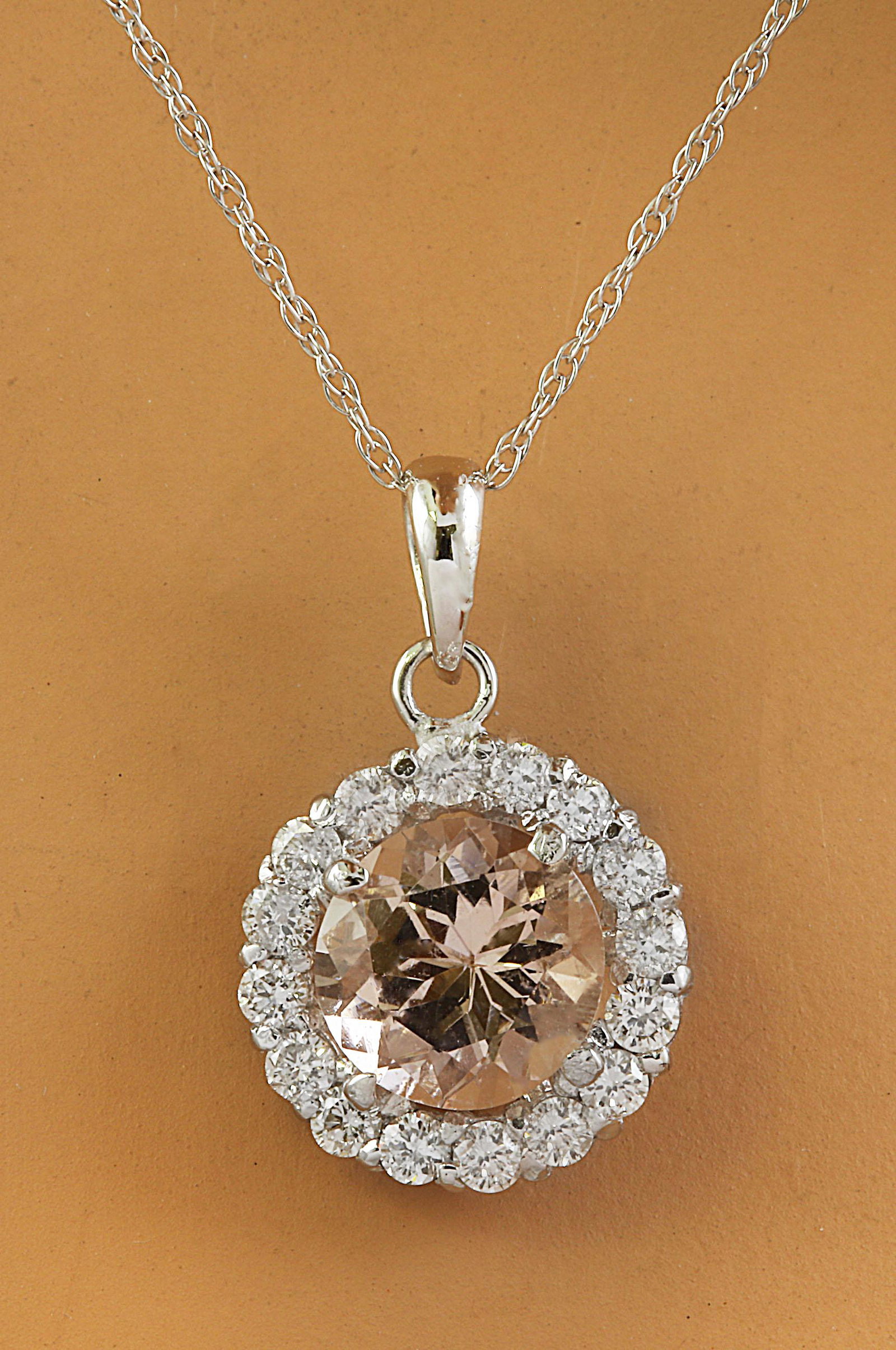 1.82 Carat Morganite 18K White Gold Diamond Necklace: Stamped: 18K Total Necklace Weight: 0.90 Grams Necklace Length 18 Inches Morganite Weight: 1.50 Carat (7.00x7.00 Millimeters) Diamond Weight: 0.32 Carat (F-G Color, VS2-SI1 Clarity) Face Measures: 10.
