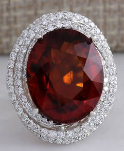 20.25 CTW Natural Hessonite Garnet And Diamond Ring: 20.25 CTW Natural Hessonite Garnet And Diamond Ring In18K White Gold Manufacturer's Suggested Retail Price: $ 14850.00 Stamped: 18K Ring Size: 6.75 Total Ring Weight: 13.2 Grams Diamond