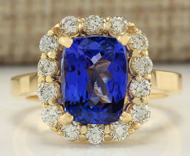 4.15 CTW Natural Tanzanite And Diamond Ring In 18K: 4.15 CTW Natural Tanzanite And Diamond Ring In 18K Yellow Gold Manufacturer's Suggested Retail Price: $ 8450.00 Stamped: 18K Ring Size: 6.5 Total Ring Weight: 6.1 Grams Diamond Weight: 