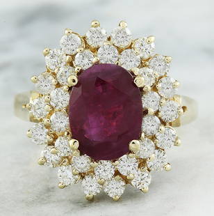 3.53 CTW Ruby 14K Yellow Gold Diamond Ring: 3.53 CTW Ruby 14K Yellow Gold Diamond Ring Manufacturer's Suggested Retail Price: $ 7900.00 Stamped: 14K Total Ring Weight: 5.2 Grams Ruby Weight 2.03 Carat (9.00x7.00 Millimeters) Diamond