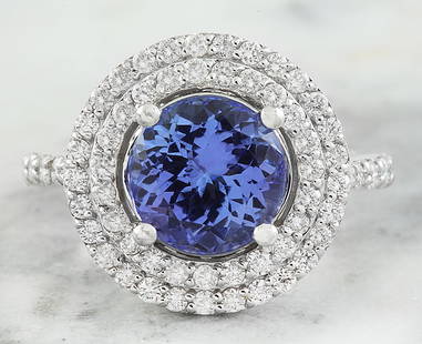 4.32 CTW Tanzanite 18K White Gold Diamond Ring: 4.32 CTW Tanzanite 18K White Gold Diamond Ring Manufacturer's Suggested Retail Price: $ 7750.00 Stamped: 18K Total Ring Weight: 5 Grams Tanzanite Weight 3.57 Carat (9.00x9.00 Millimeters)
