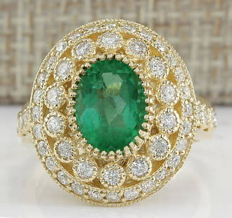 3.16 CTW Natural Colombian Emerald And Diamond Ring In: 3.16 CTW Natural Colombian Emerald And Diamond Ring In 18K Yellow Gold Manufacturer's Suggested Retail Price: $ 8650.00 Stamped: 18K Ring Size: 7 Total Ring Weight: 7.9 Grams Diamond Weight: 