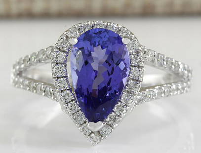 2.80 CTW Natural Blue Tanzanite And Diamond Ring 18K: 2.80 CTW Natural Blue Tanzanite And Diamond Ring 18K Solid White Gold Manufacturer's Suggested Retail Price: $ 6450.00 Stamped: 18K Ring Size: 6.5 Total Ring Weight: 3.5 Grams Diamond Weight: