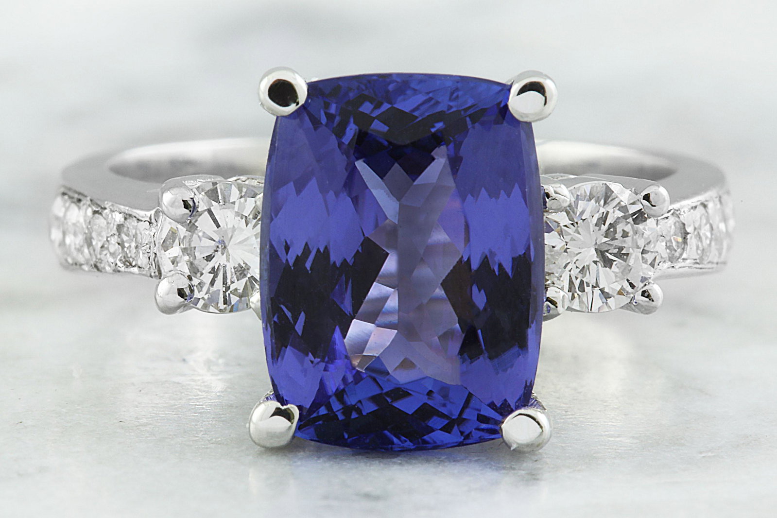 5.40 CTW Tanzanite 14K White Gold Diamond Ring: 5.40 CTW Tanzanite 14K White Gold Diamond Ring Manufacturer's Suggested Retail Price: $ 7450.00 Stamped: 14K Total Ring Weight: 4.8 Grams Tanzanite Weight 4.40 Carat (11.00x8.00 Millimeters) Diamond W