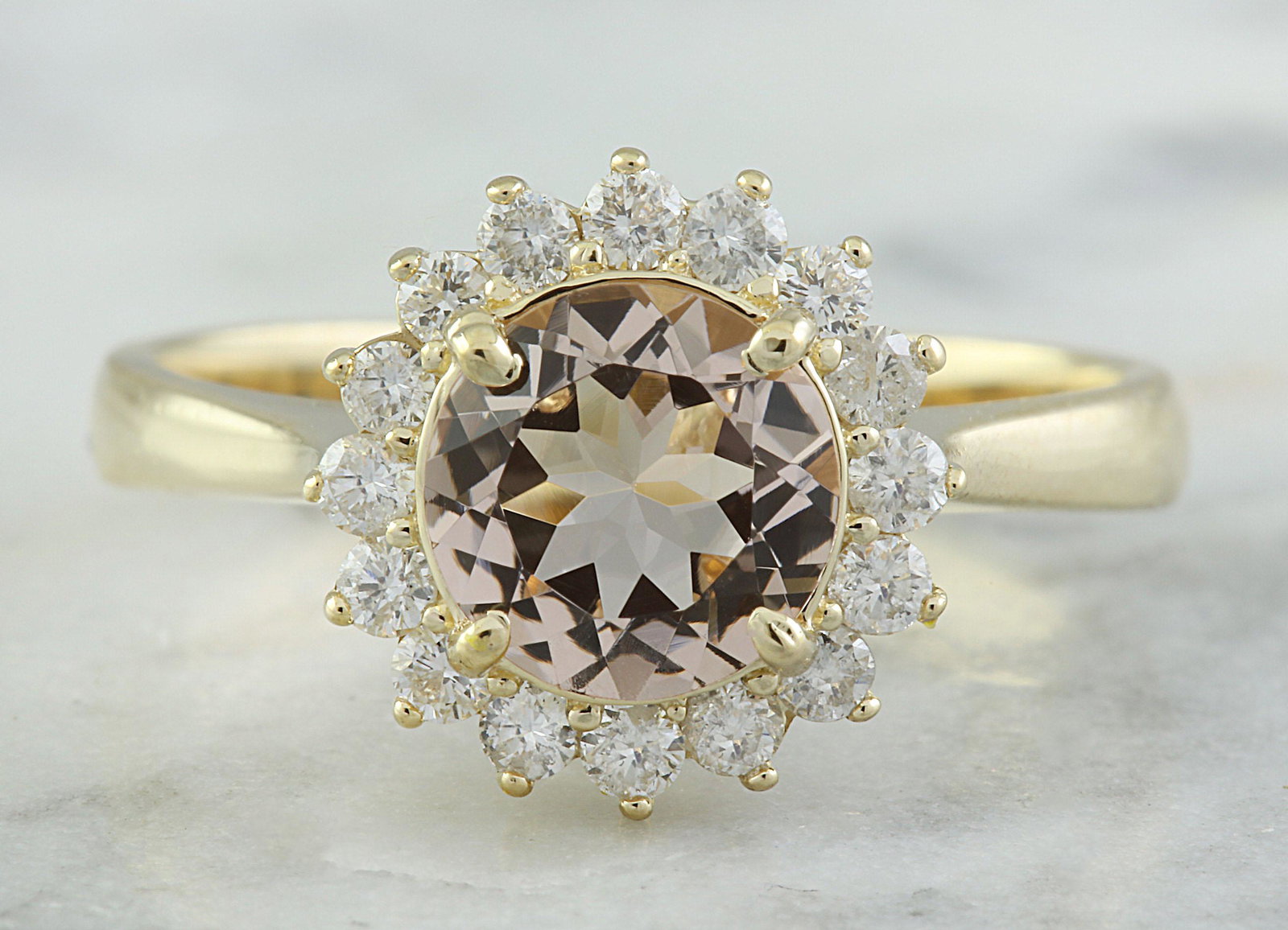 1.50 CTW Morganite 14K Yellow Gold Diamond Ring: 1.50 CTW Morganite 14K Yellow Gold Diamond Ring Manufacturer's Suggested Retail Price: $ 2200.00 Stamped: 14K Ring Size: 7 Total Ring Weight: 3.2 Grams Morganite Weight: 1.10 Carat (7.00x7.00 Millimet