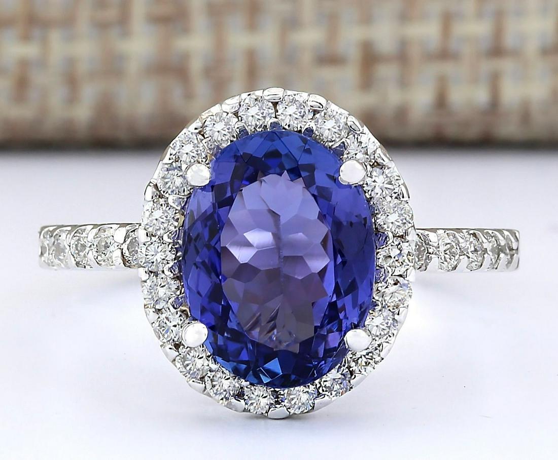 3.63 CTW Natural Blue Tanzanite And Diamond Ring 14k: 3.63 CTW Natural Blue Tanzanite And Diamond Ring 14k Solid White Gold Manufacturer's Suggested Retail Price: $ 6050.00 Stamped: 14K Ring Size: 6.75 Total Ring Weight: 3.9 Grams Diamond Weight: Total N