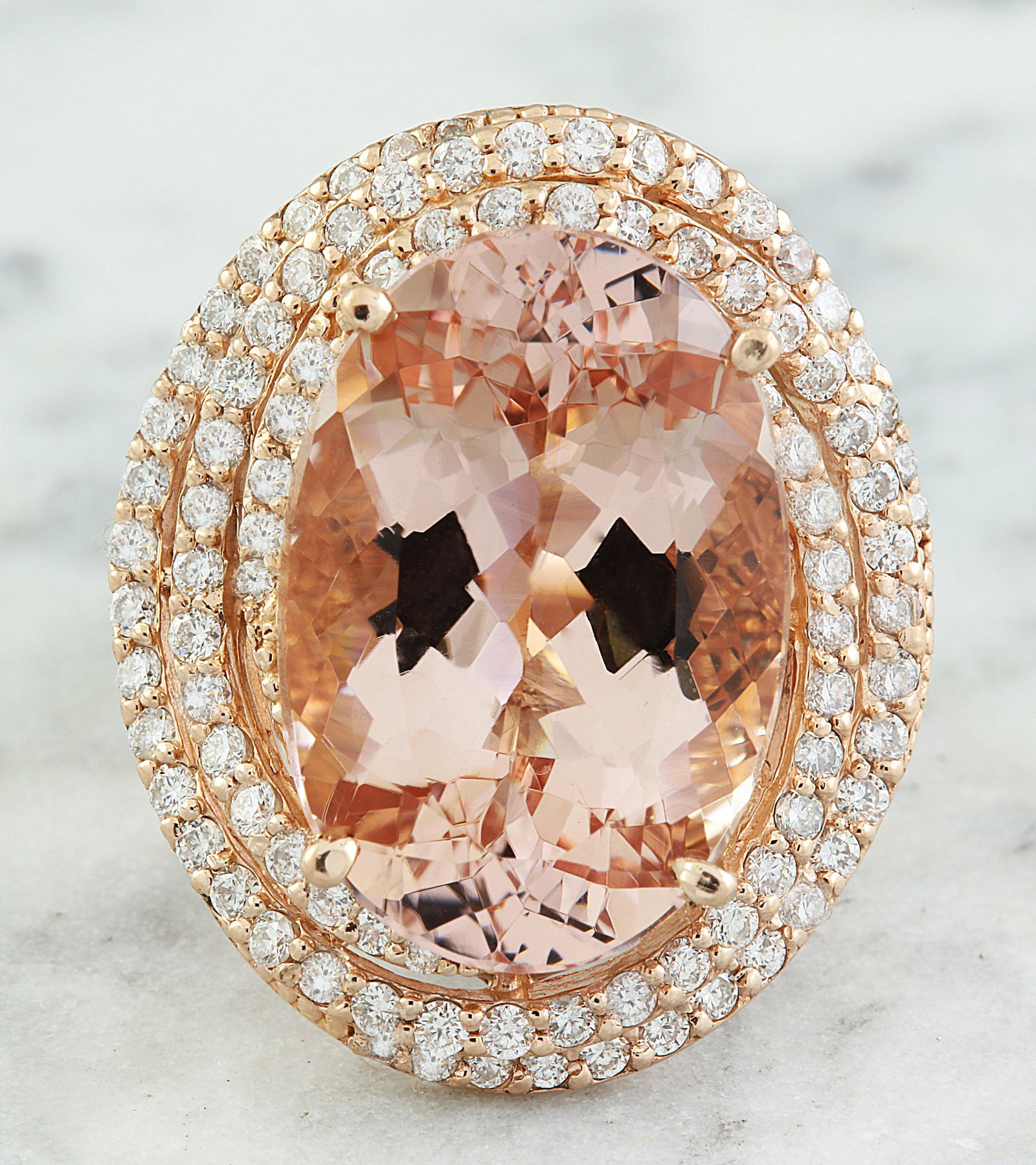 14.58 CTW Morganite 18K Rose Gold Diamond Ring: 14.58 CTW Morganite 18K Rose Gold Diamond Ring Manufacturer's Suggested Retail Price: $ 11050.00 Stamped: 18K Total Ring Weight: 12 Grams Morganite Weight: 13.38 Carat (19.40x13.20 Millimeters) Diamon