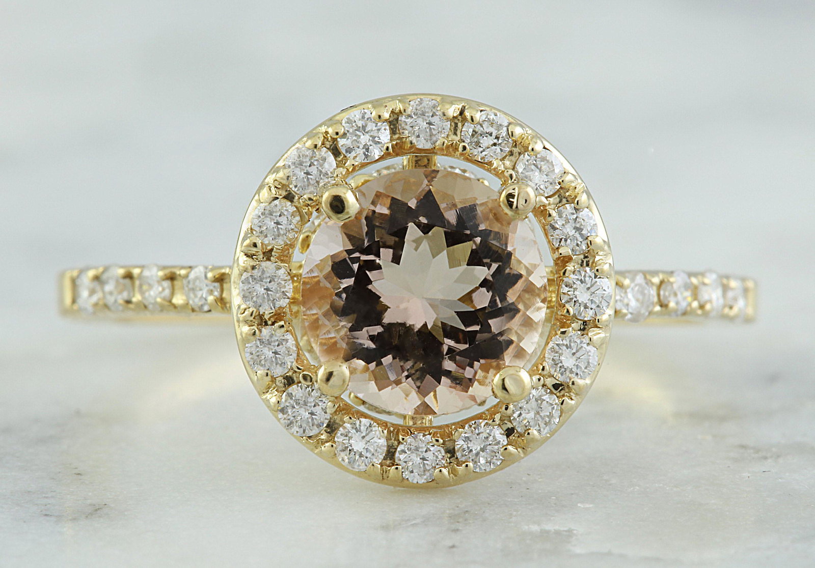 1.60 CTW Morganite 18K Yellow Gold Diamond Ring: 1.60 CTW Morganite 18K Yellow Gold Diamond Ring Manufacturer's Suggested Retail Price: $ 2400.00 Stamped: 18K Ring Size: 7 Total Ring Weight: 2.6 Grams Morganite Weight: 1.20 Carat (7.00x7.00 Millimet
